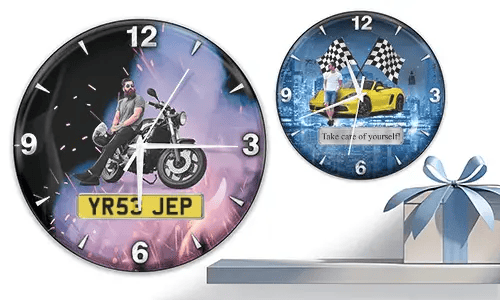 Two wall clocks with male figures and vehicles: left with motorcycle and flame background, right with yellow sports car and racing flags