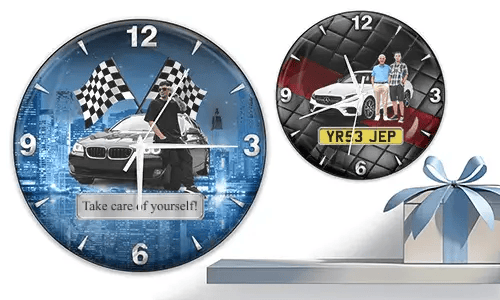Two wall clocks with white cars and male figures: left with cityscape and racing flags, right with quilted red-black background