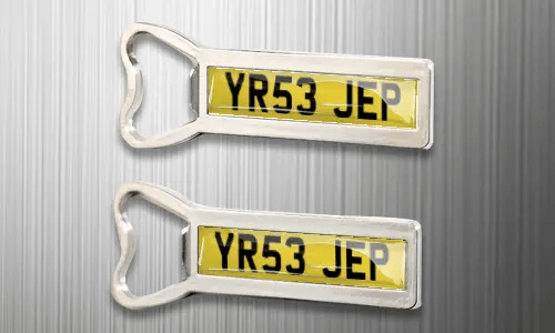 two magnet bottle openers on the fridge