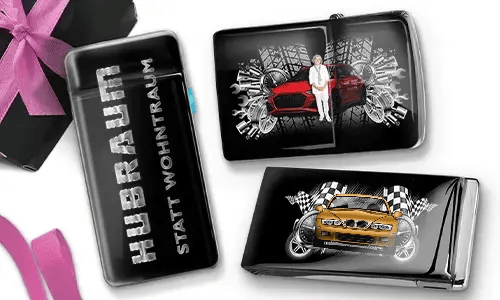Three black and silver car-themed cigarette cases with dynamic graphics. One reads 