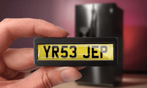 license plate magnet in hand