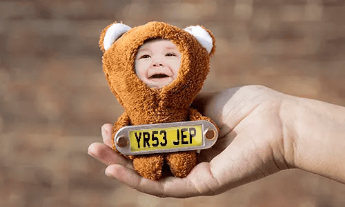 Cuddly toy with photo in hand