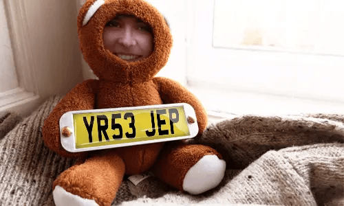 Cuddly toy with photo in the house