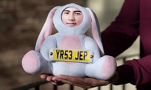 Cuddly toy with photo in hands