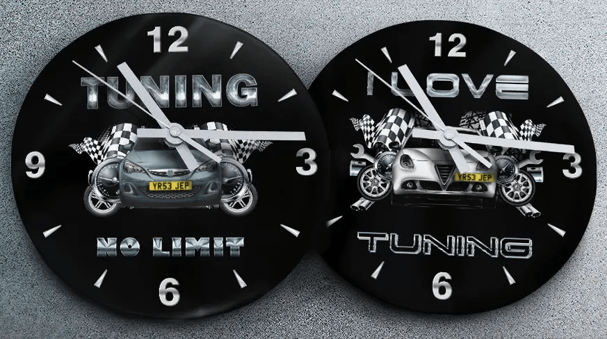 Two racing-themed wall clocks: left with black car and TUNING NO LIMIT text, right with blue car and MOVE TUNING text