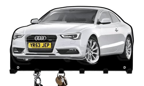 Wall-mounted key holder shaped like a white Audi car with hooks for organizing keys